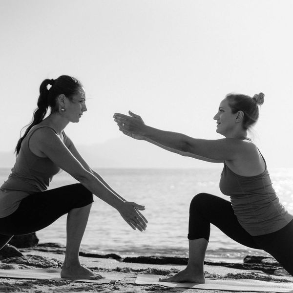 Person doing morning stretching exercise at sunrise